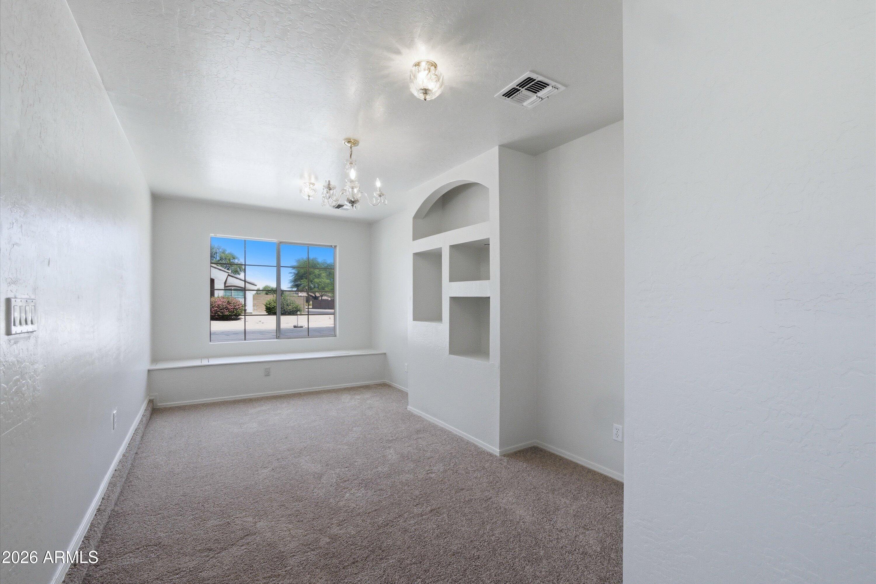 2933 West Maldonado Road Phoenix, AZ 85041 - Photo 18 of 27 a view of a big room with windows and cabinet