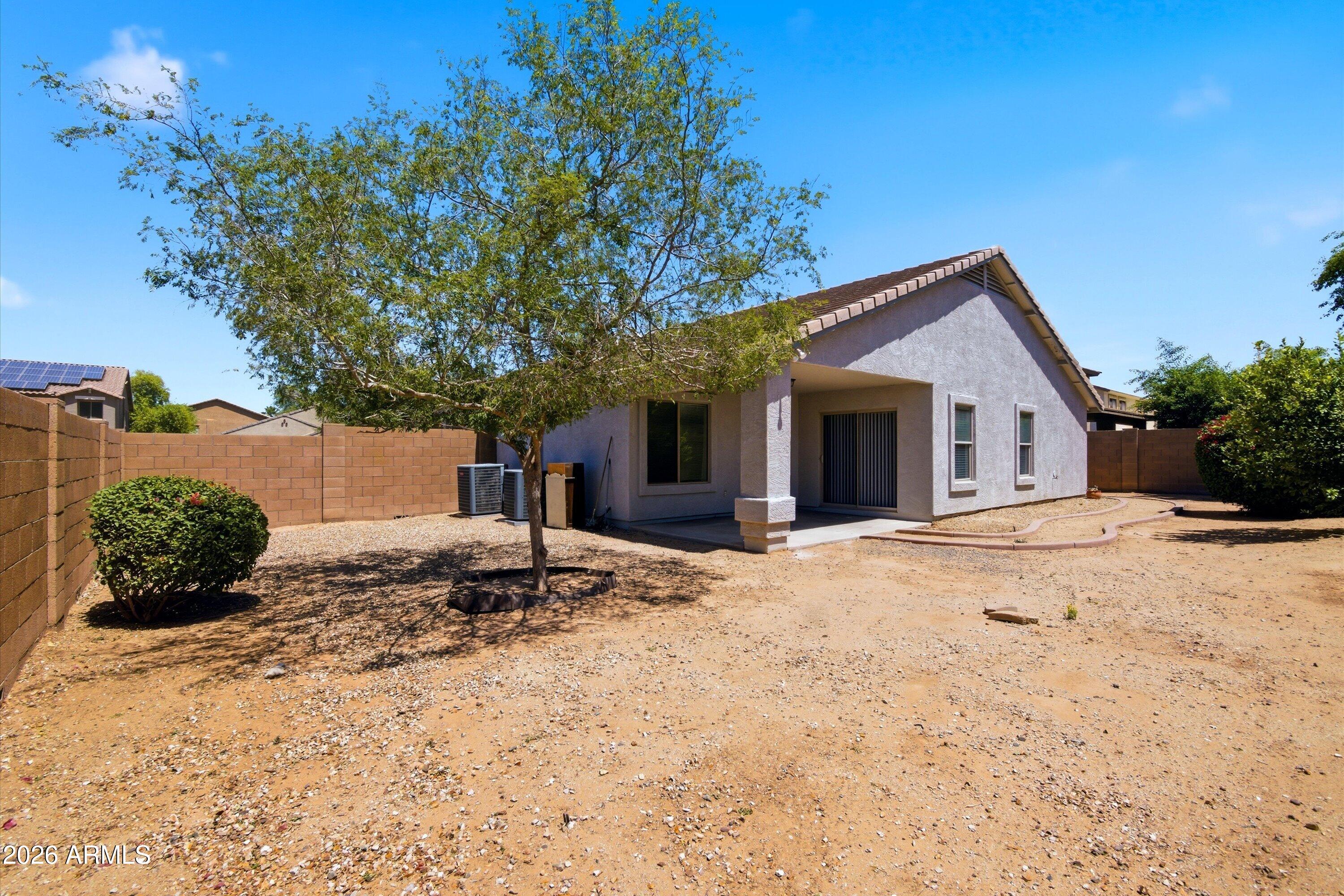 2933 West Maldonado Road Phoenix, AZ 85041 - Photo 25 of 27 a front view of a house with a yard
