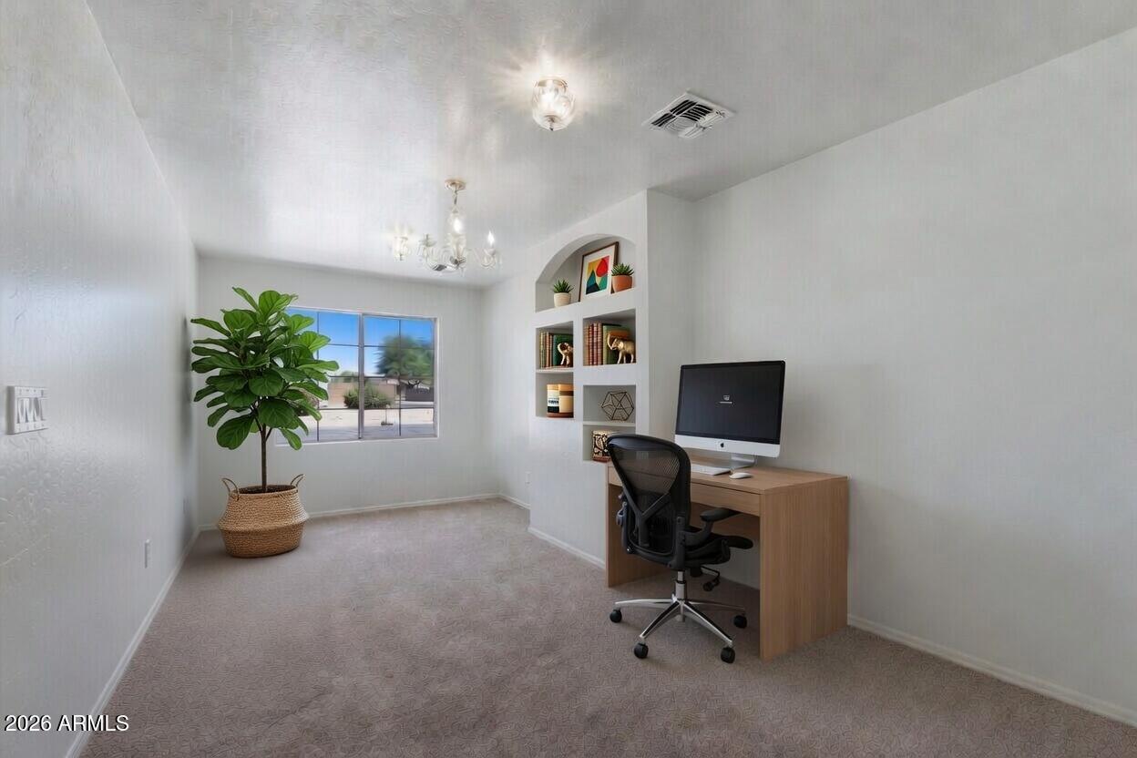 2933 West Maldonado Road Phoenix, AZ 85041 - Photo 8 of 27 a view of a workspace with furniture