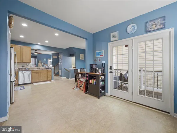 a view of a livingroom with furniture and a ceiling fan