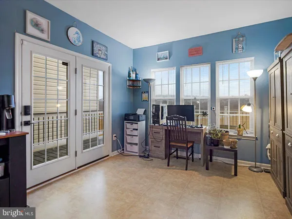 a workspace with furniture and a window