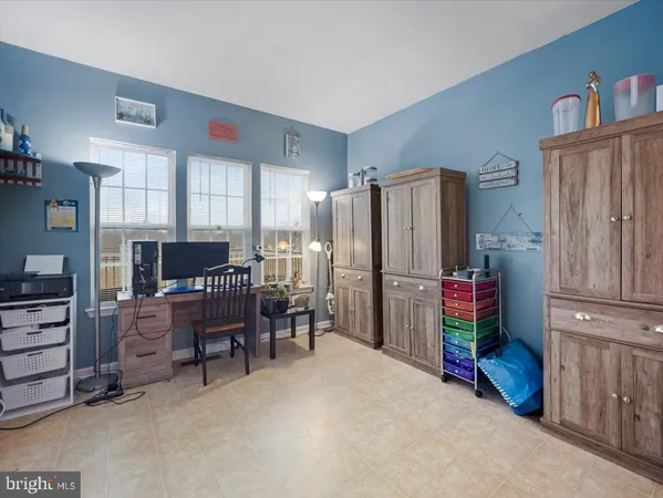 a kitchen with stainless steel appliances a refrigerator and wooden cabinets