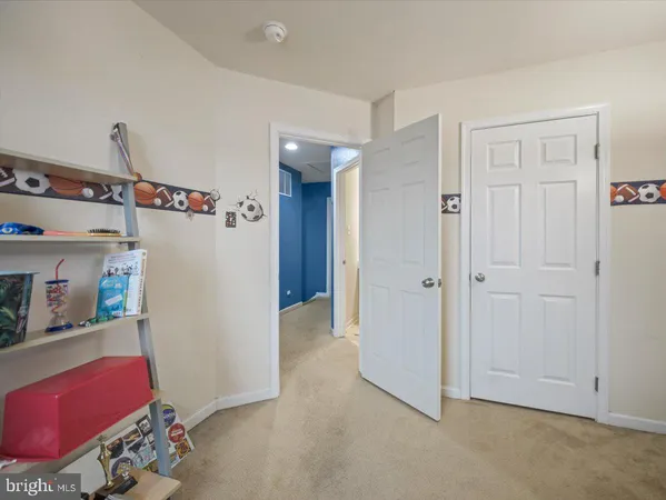 a view of hallway with livingroom and furniture