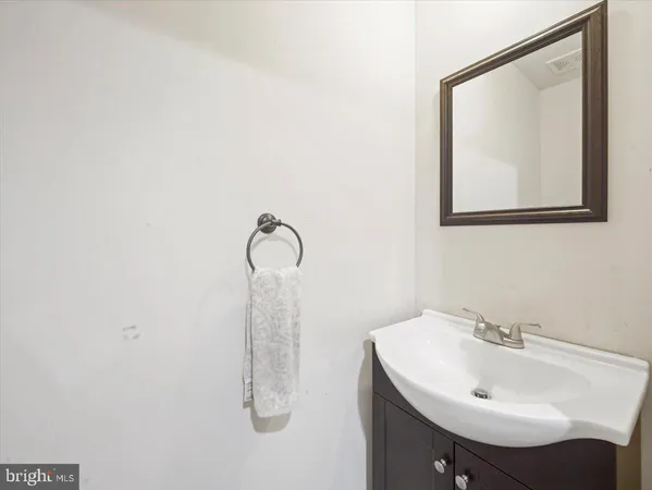 a bathroom with a sink and mirror