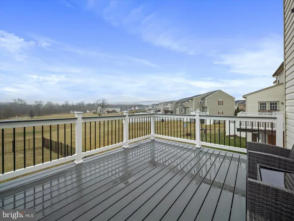 a view of a balcony with wooden floor
