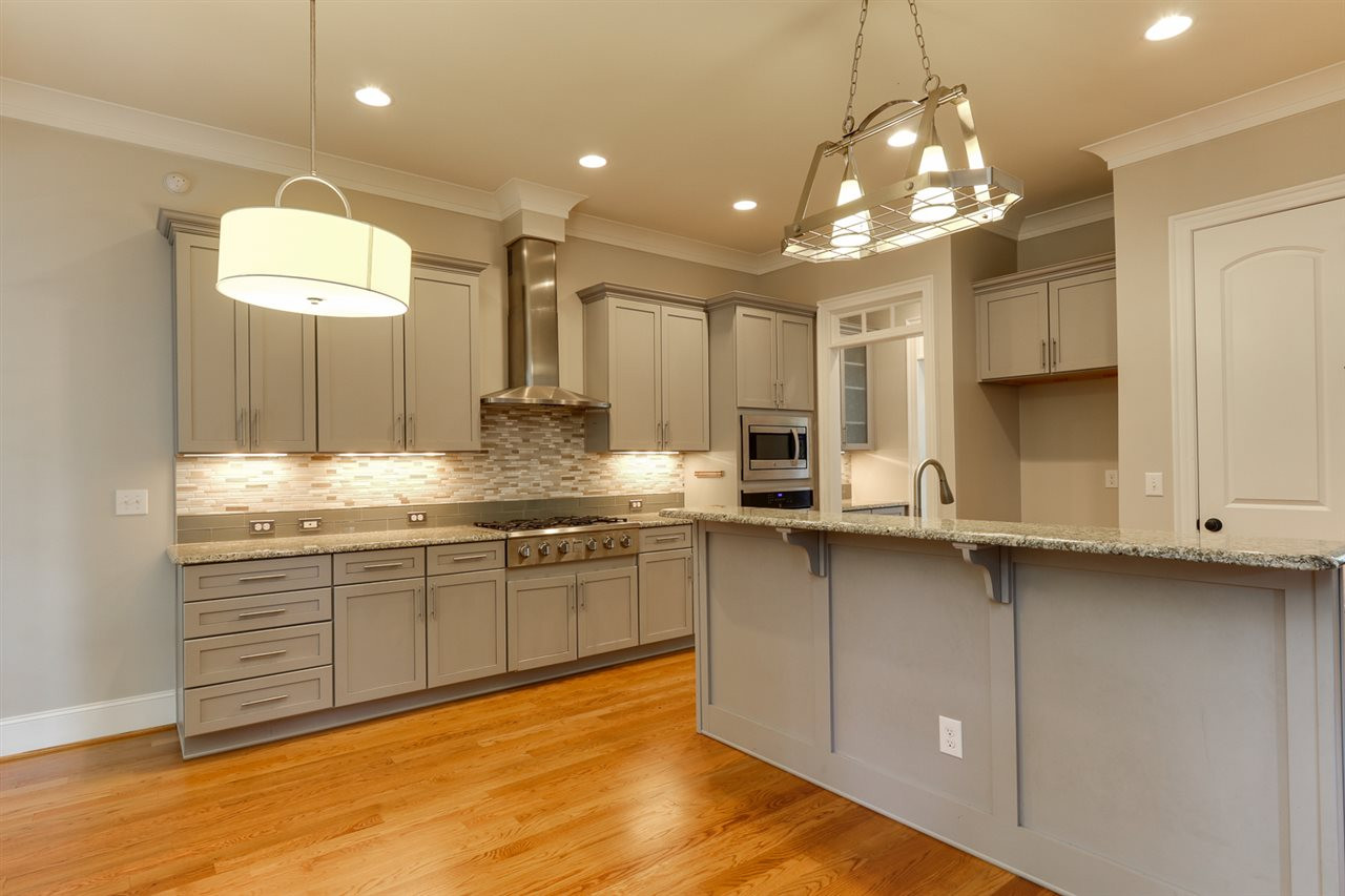 1103 Temple Street Raleigh, NC 27609 - Photo 4 of 30 Main level gourmet kitchen with gas cooktop and hood Gourmet Kitchen