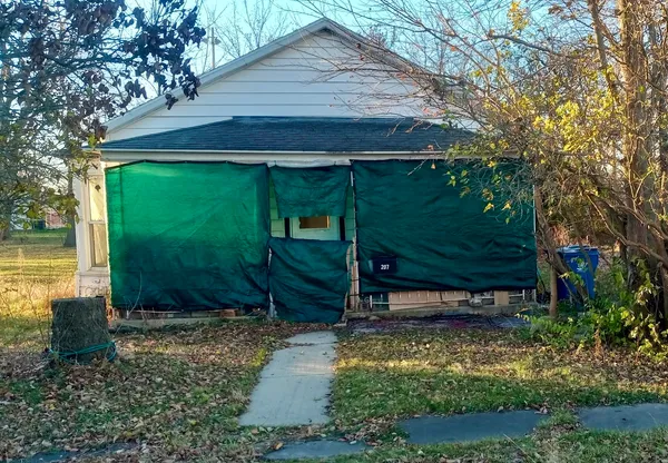 a backyard of a house with lots of green space