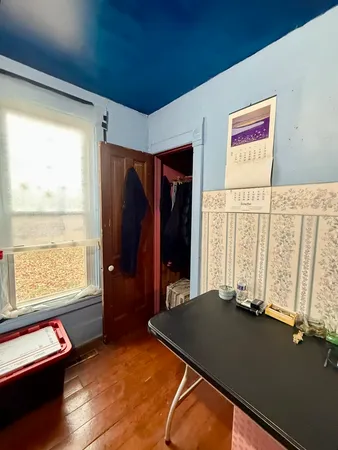 a view of a room with furniture and a window