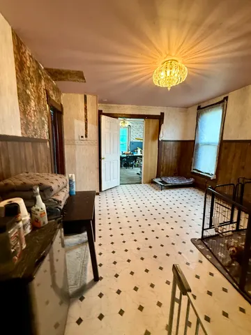 a bedroom with furniture and a dresser