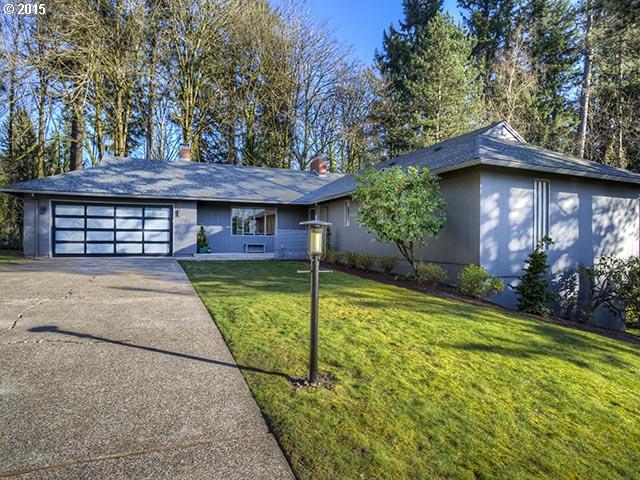4140 Southwest 40th Place Portland, OR 97221 - Photo 1 of 16 a front view of a house with garden