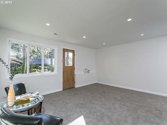 4140 Southwest 40th Place Portland, OR 97221 - Photo 11 of 16 a living room with furniture and a window