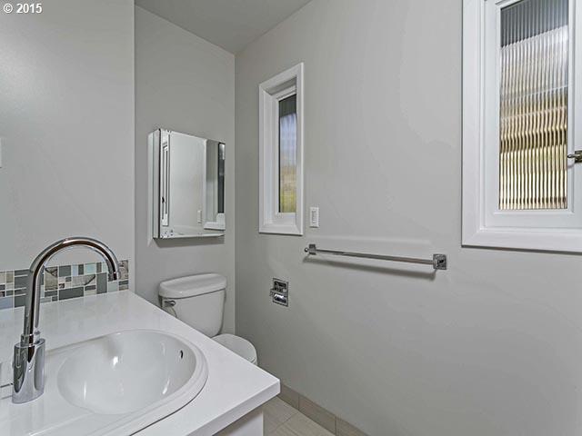 4140 Southwest 40th Place Portland, OR 97221 - Photo 8 of 16 a bathroom with a sink and a mirror