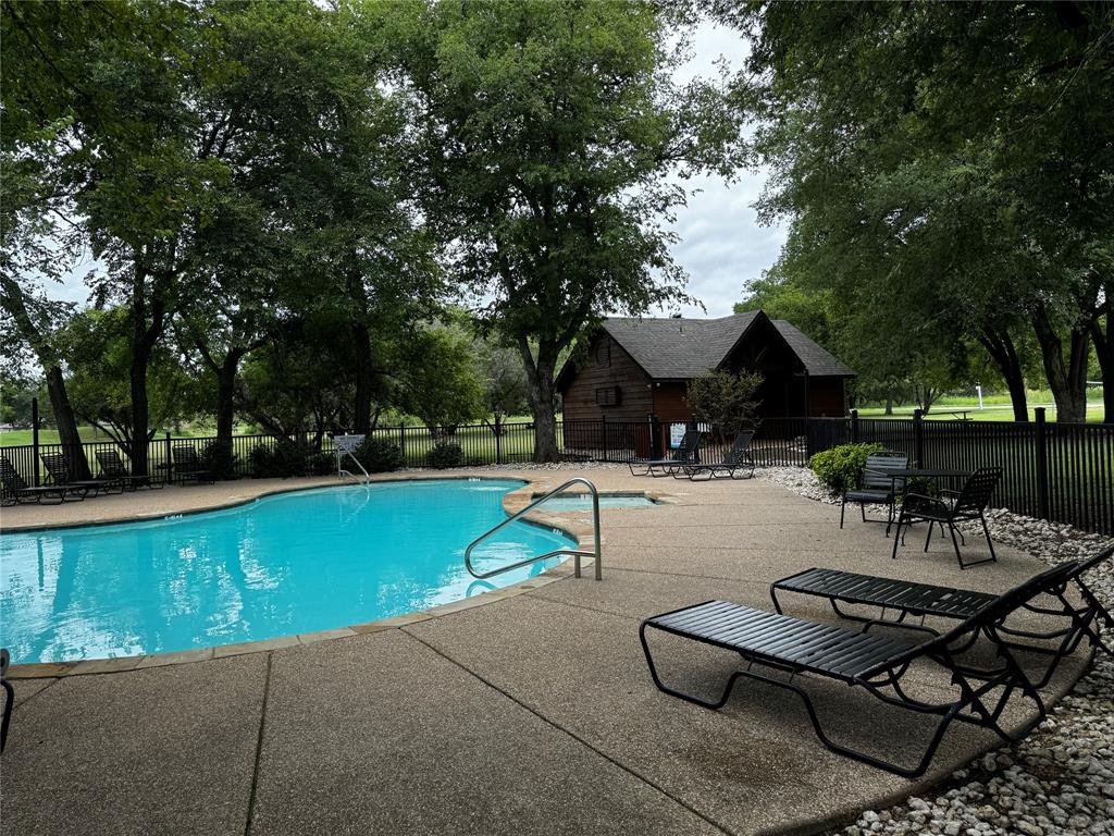 4044 High Point Drive Whitney, TX 76692 - Photo 12 of 14 a view of a swimming pool with seating space