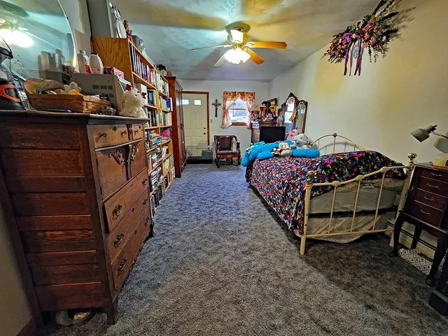 a bed room with a bed and a baby