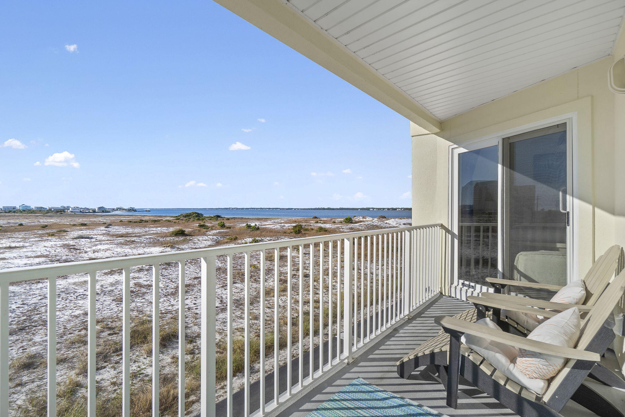 8436 Gulf Boulevard, Unit 321 Navarre, FL 32566 - Photo 14 of 57 a view of a balcony with a chair
