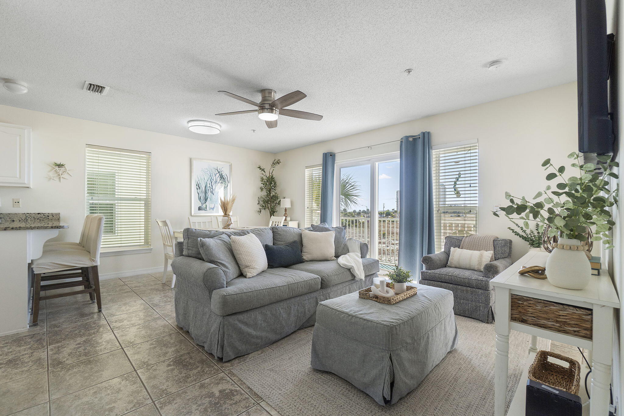 8436 Gulf Boulevard, Unit 321 Navarre, FL 32566 - Photo 18 of 57 a living room with furniture and a large window