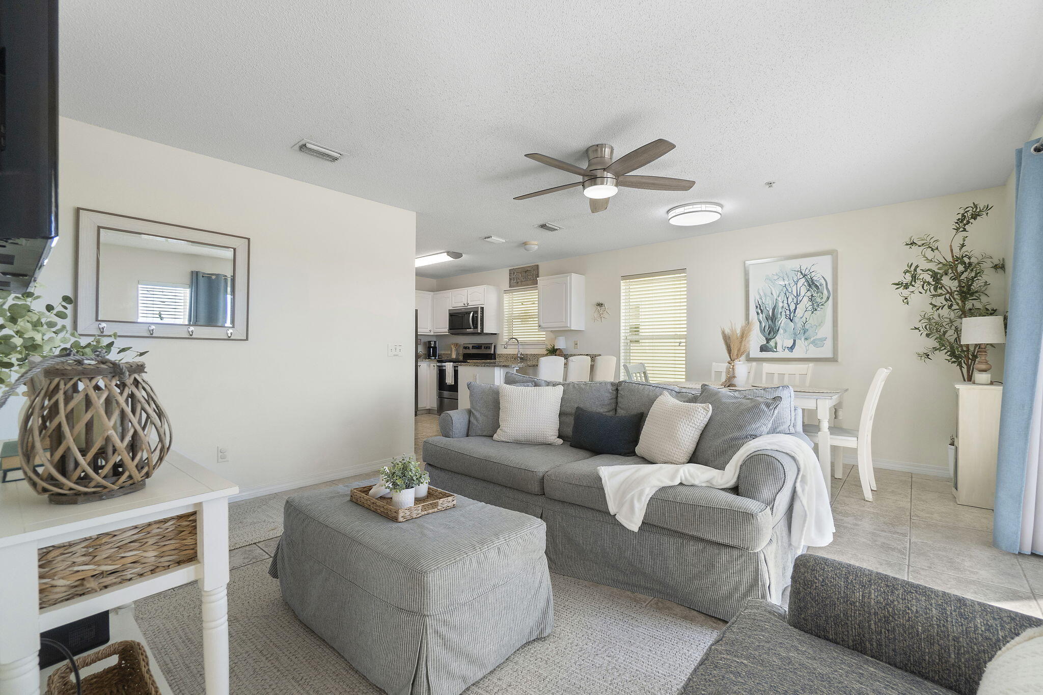 8436 Gulf Boulevard, Unit 321 Navarre, FL 32566 - Photo 19 of 57 a living room with furniture and wooden floor