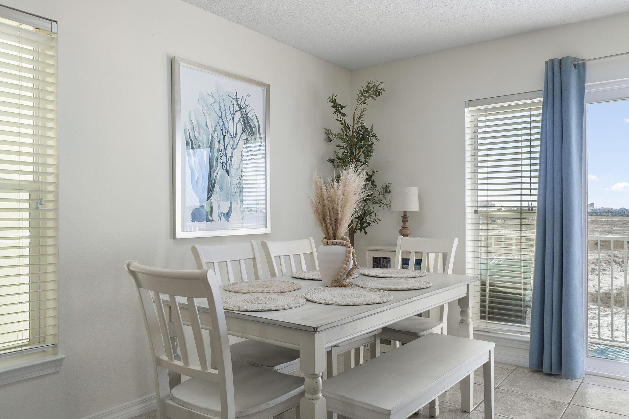 8436 Gulf Boulevard, Unit 321 Navarre, FL 32566 - Photo 21 of 57 a dining room with furniture and window