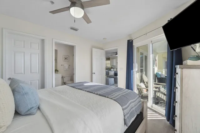 a bedroom with a bed with wooden floor