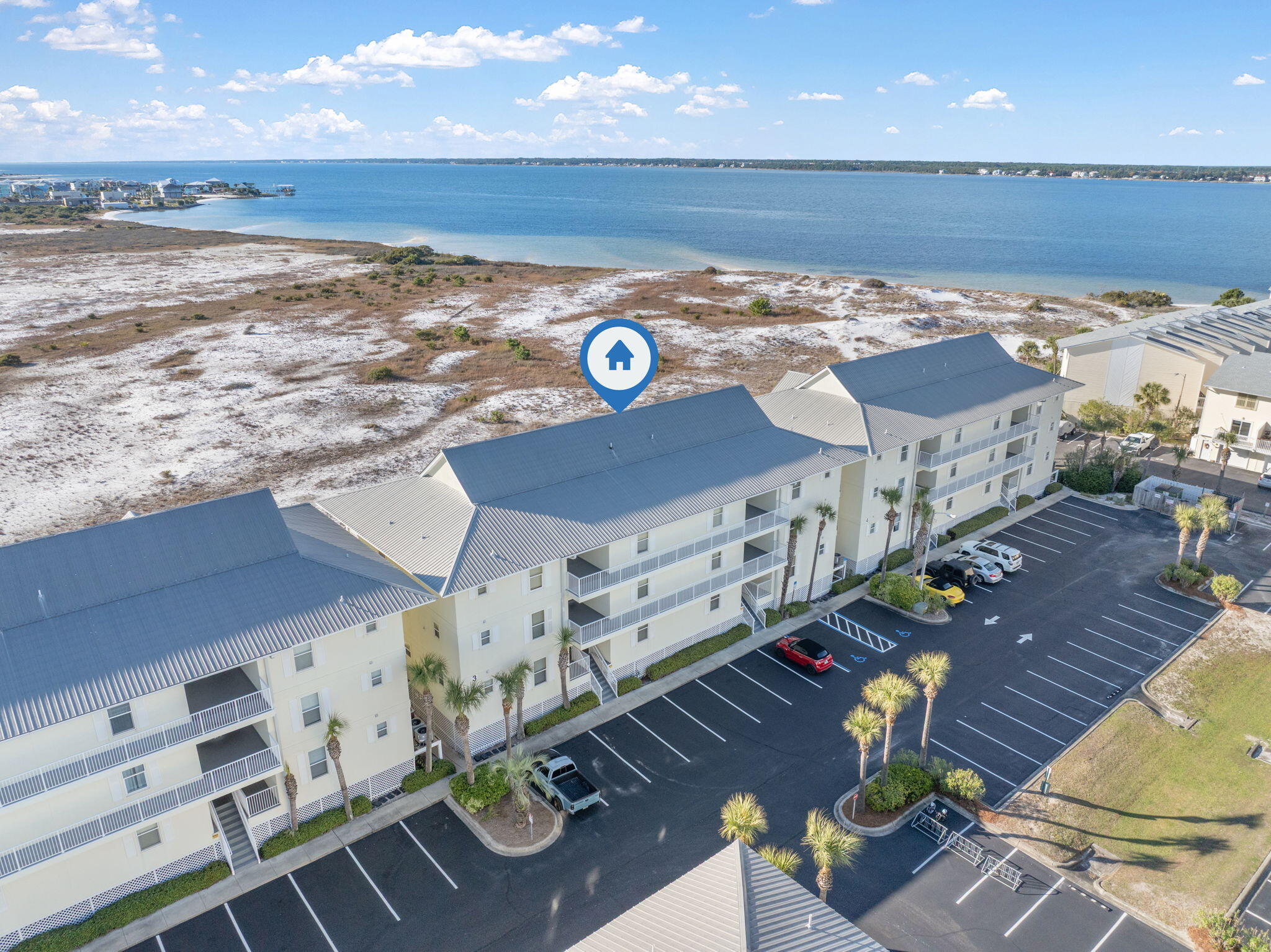 8436 Gulf Boulevard, Unit 321 Navarre, FL 32566 - Photo 45 of 57 a view of an ocean and a floor to ceiling window