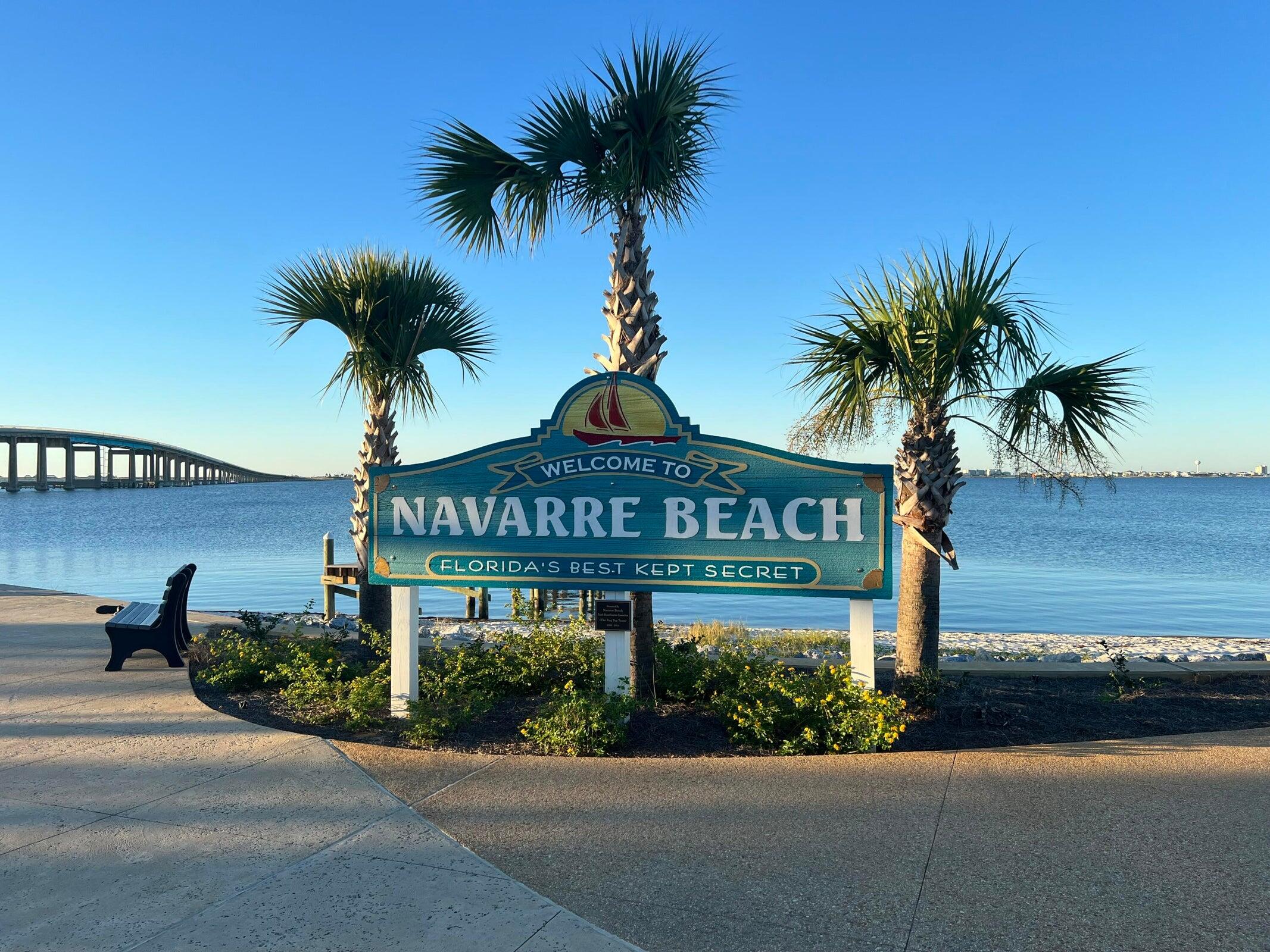 8436 Gulf Boulevard, Unit 321 Navarre, FL 32566 - Photo 53 of 57 a view of street sign under an umbrella