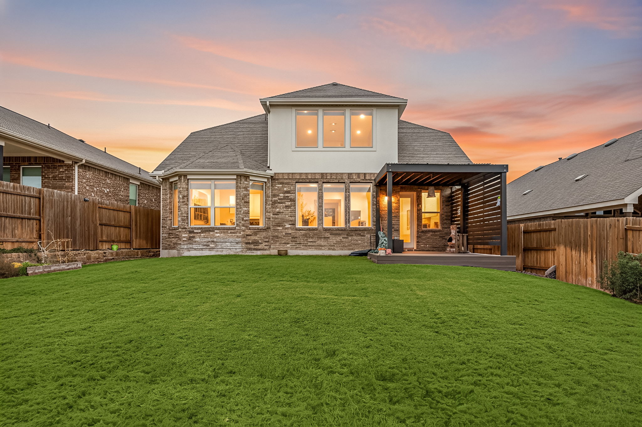 1098 Cherrystone Loop Buda, TX 78610 - Photo 33 of 37 a front view of a house with a garden