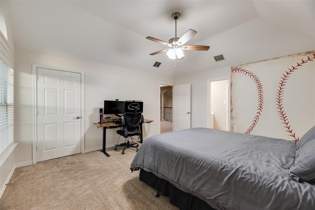 11920 Vienna Apple Road Fort Worth, TX 76244 - Photo 33 of 40 Upstairs oversized bedroom with carpet, ceiling fan, large walk-in closet and ensuite Jack & Jill bathroom at 11920 Vienna Apple in Villages of Woodland Springs community in North Fort Worth