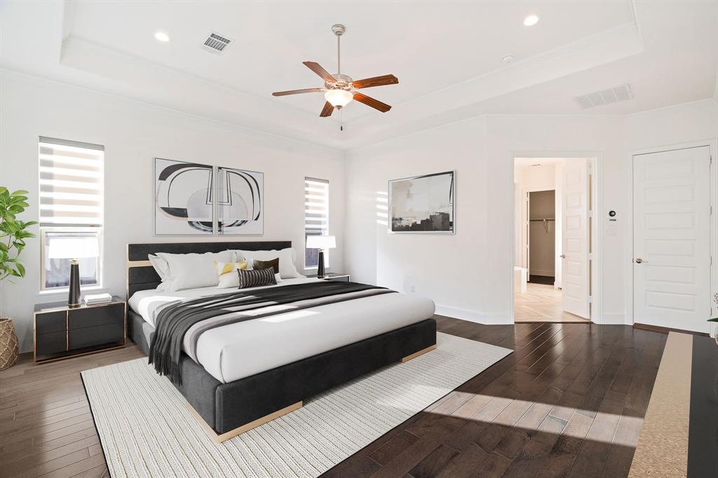 2441 Flat Creek Road Frisco, TX 75036 - Photo 16 of 34 Bedroom featuring a raised ceiling, dark wood-type flooring, a ceiling fan, recessed lighting, and crown molding