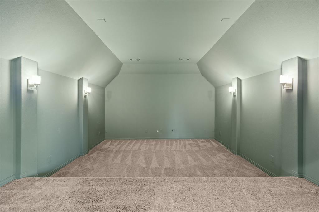 2441 Flat Creek Road Frisco, TX 75036 - Photo 29 of 34 Bonus room featuring lofted ceiling and carpet flooring