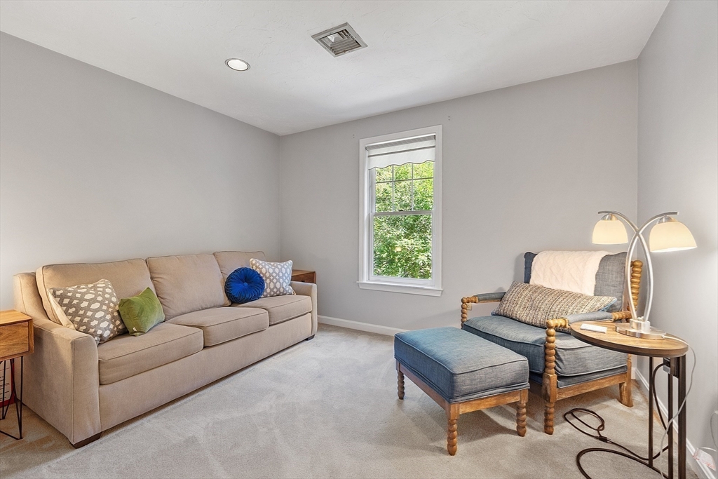 9 Blanchard Road Harvard, MA 01451 - Photo 22 of 33 a living room with a couch and a table