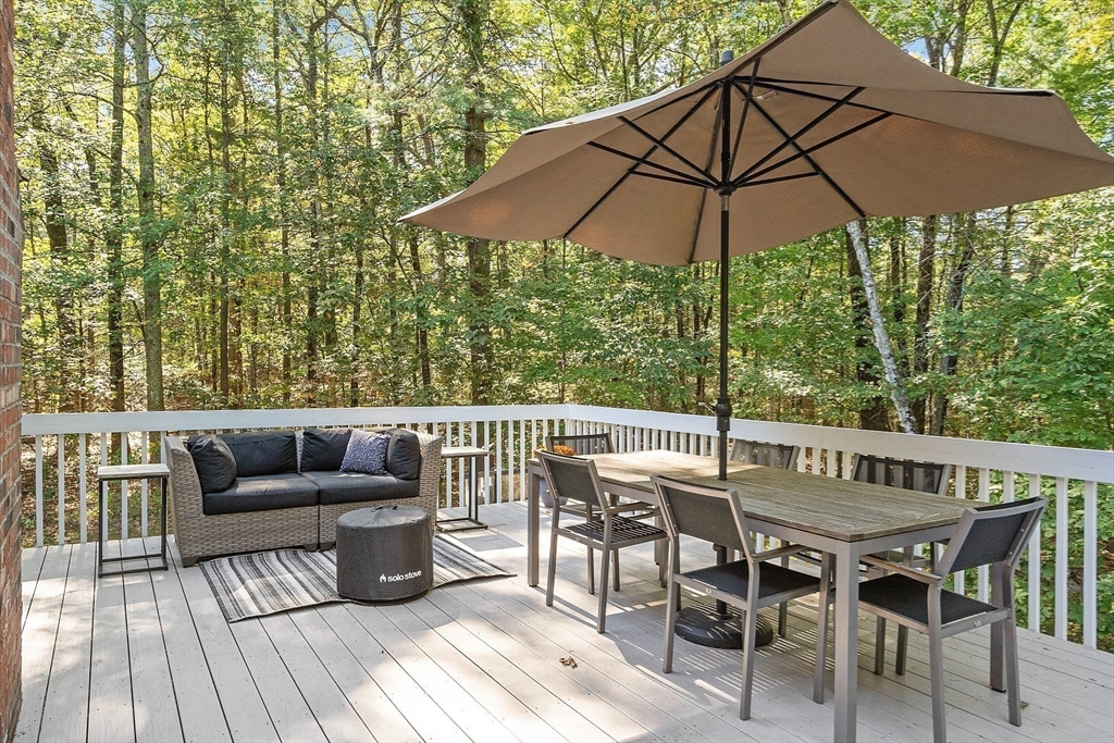 9 Blanchard Road Harvard, MA 01451 - Photo 25 of 33 a view of deck with furniture and umbrella