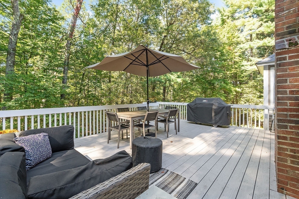9 Blanchard Road Harvard, MA 01451 - Photo 26 of 33 a view of a roof deck with chair and wooden floor