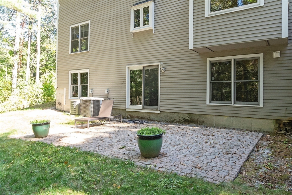 9 Blanchard Road Harvard, MA 01451 - Photo 28 of 33 a view of a house with backyard and sitting area