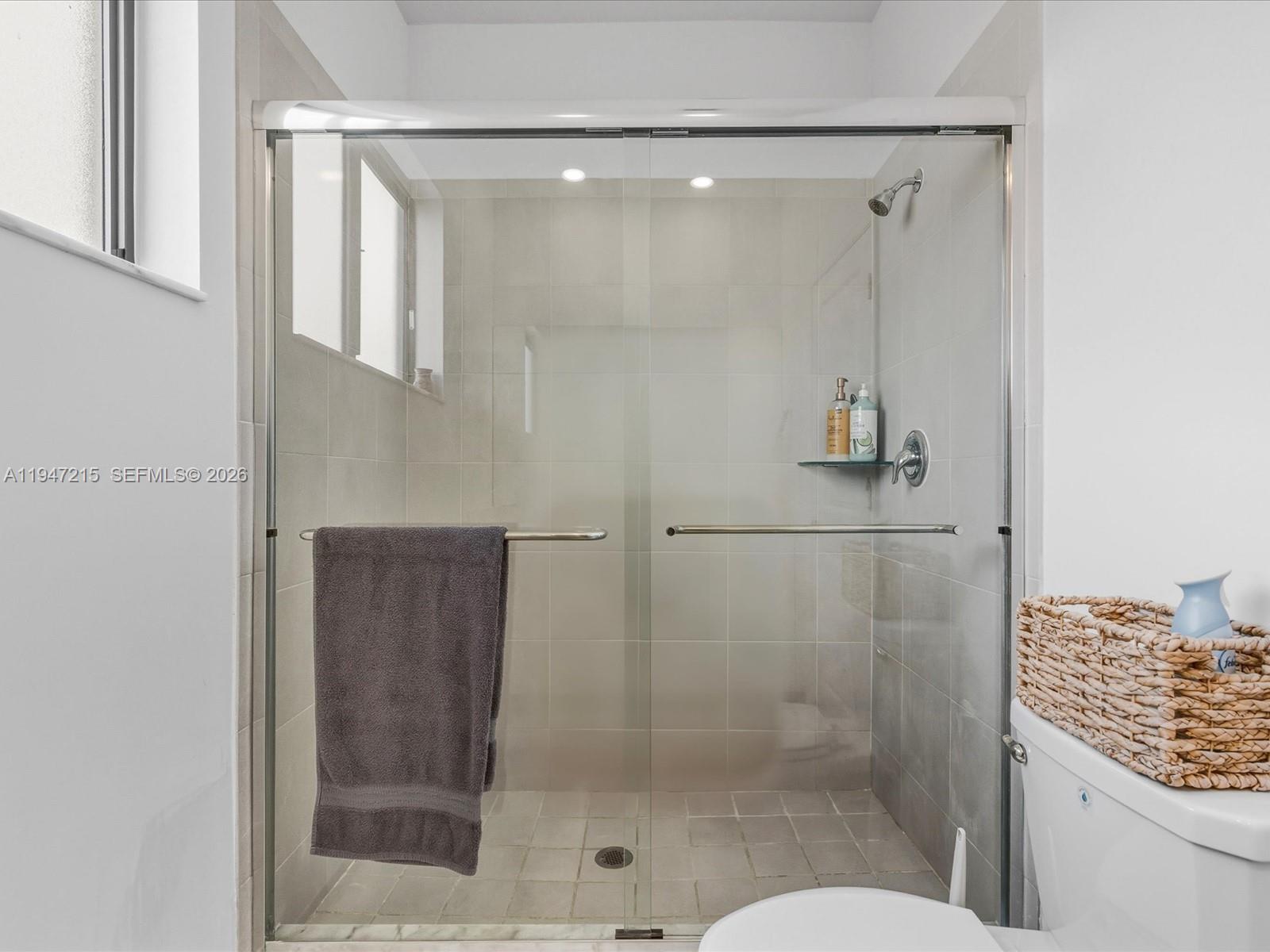 544 Northeast 206th Lane Miami, FL 33179 - Photo 21 of 48 a bathroom with a shower and toilet