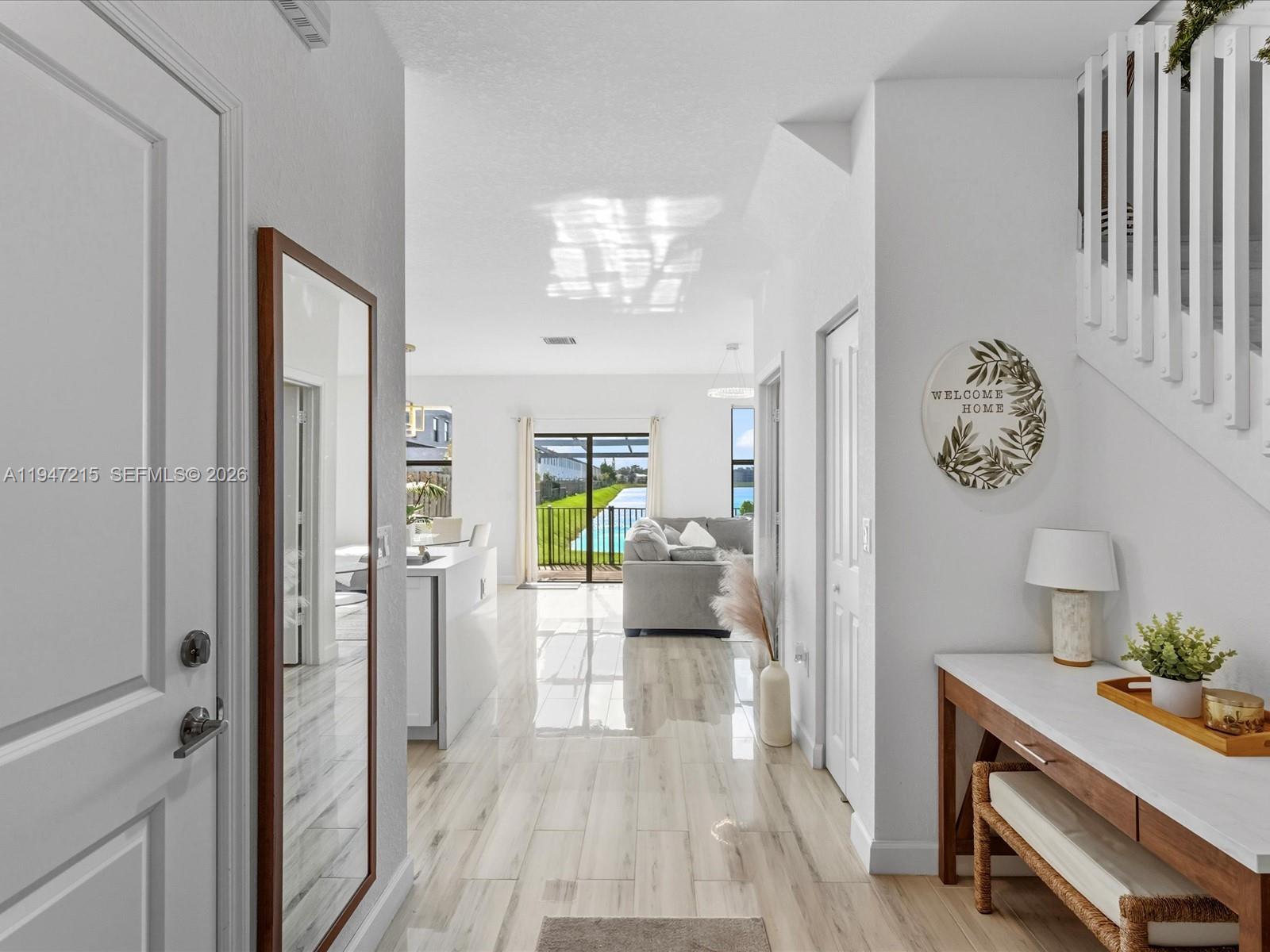 544 Northeast 206th Lane Miami, FL 33179 - Photo 3 of 48 a living room with furniture and a table