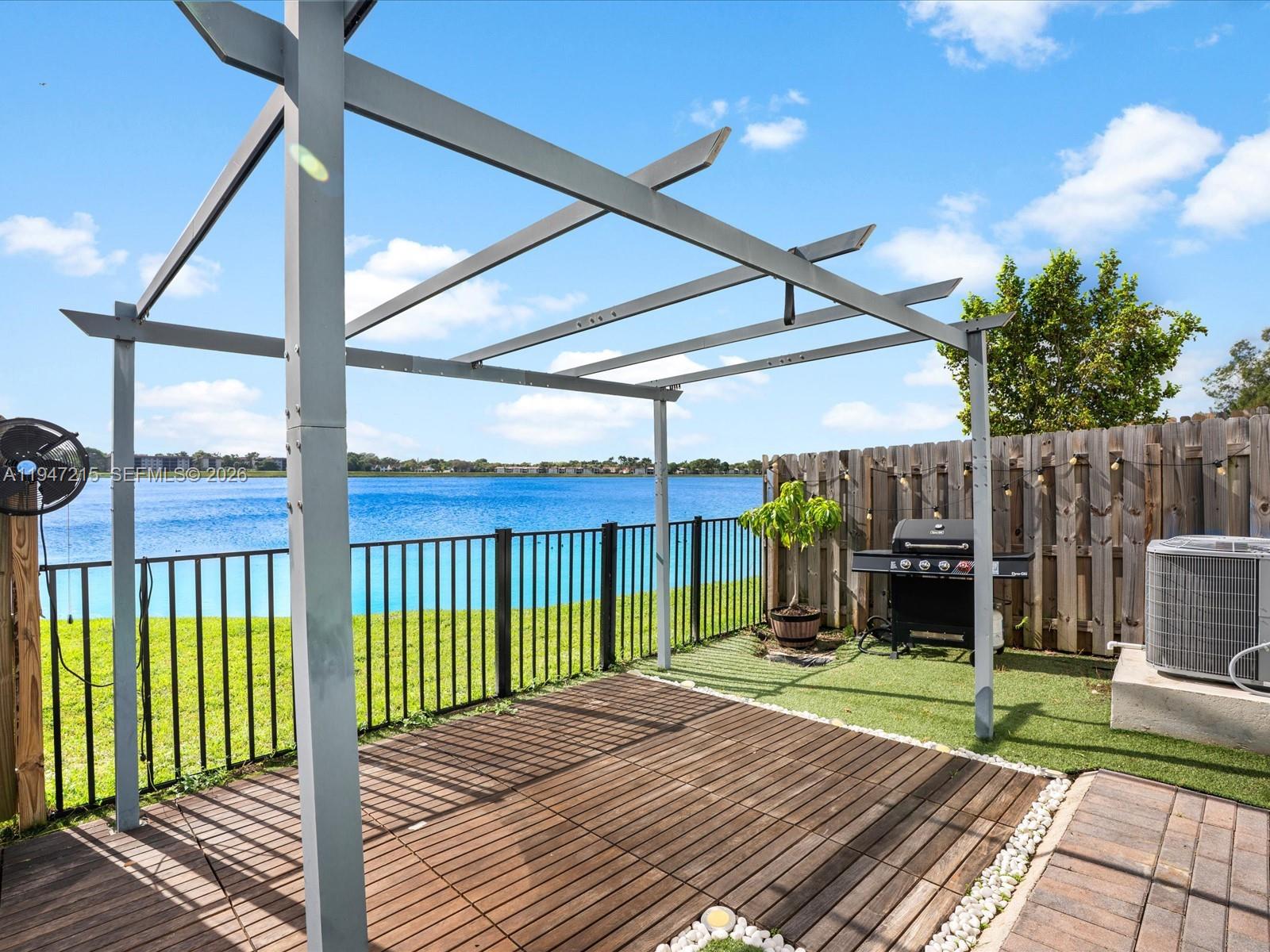 544 Northeast 206th Lane Miami, FL 33179 - Photo 33 of 48 a view of a backyard with a patio