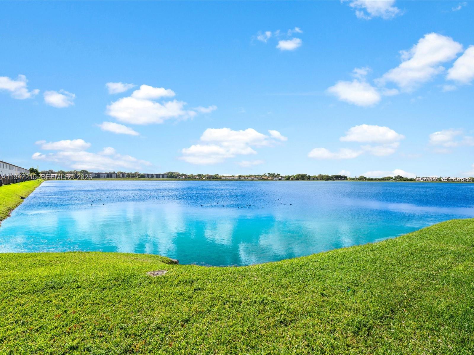 544 Northeast 206th Lane Miami, FL 33179 - Photo 35 of 48 a view of a lake from a yard