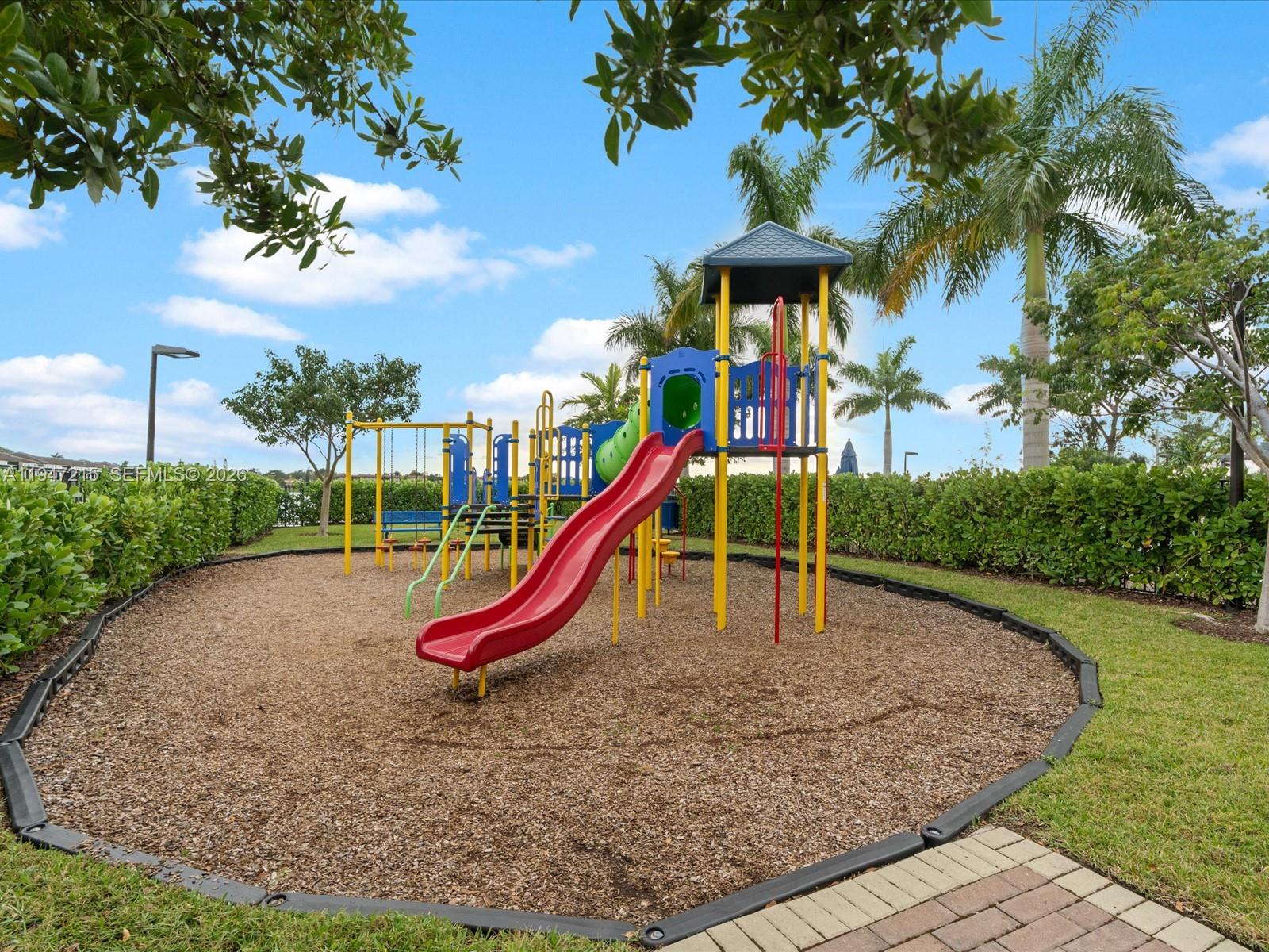 544 Northeast 206th Lane Miami, FL 33179 - Photo 41 of 48 a view of a park with a slide