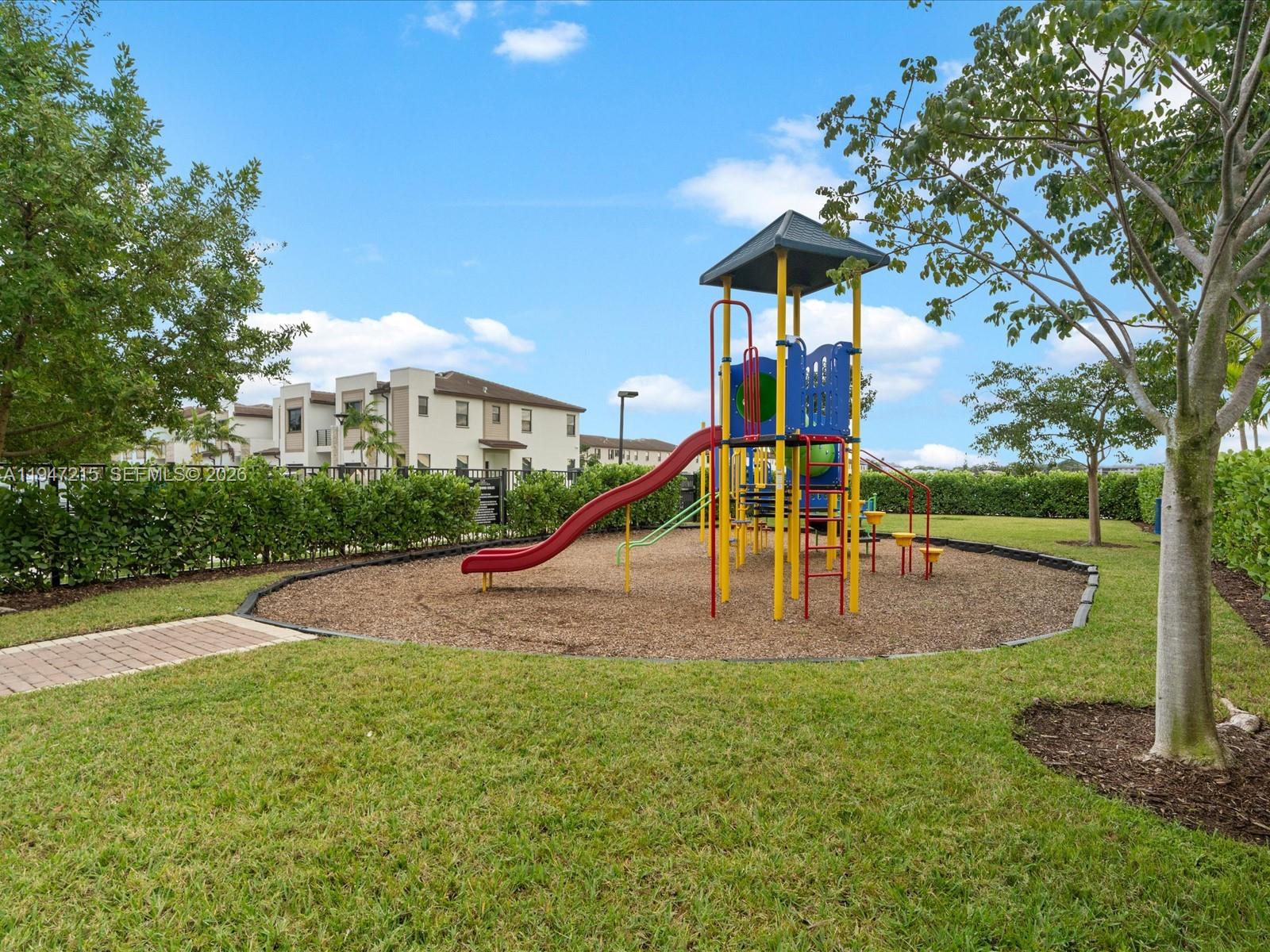 544 Northeast 206th Lane Miami, FL 33179 - Photo 42 of 48 a view of a park with a slide