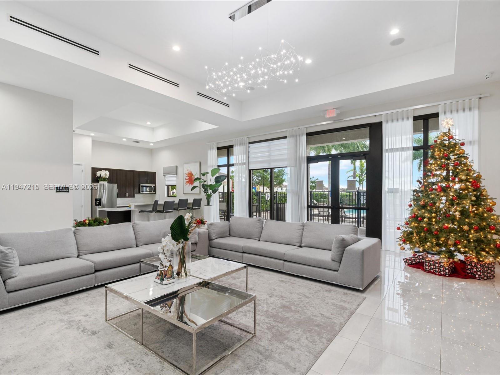544 Northeast 206th Lane Miami, FL 33179 - Photo 45 of 48 a living room with furniture and a large window