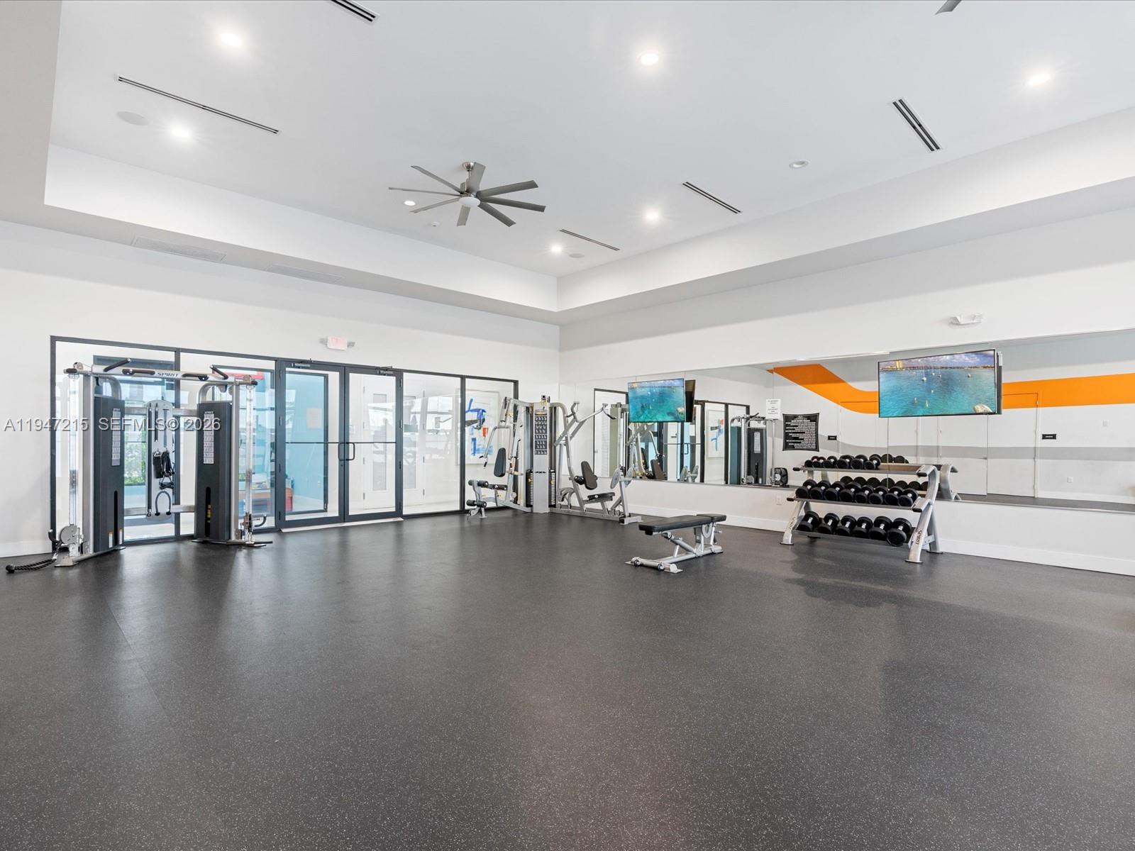 544 Northeast 206th Lane Miami, FL 33179 - Photo 48 of 48 a living room with furniture and a floor to ceiling window