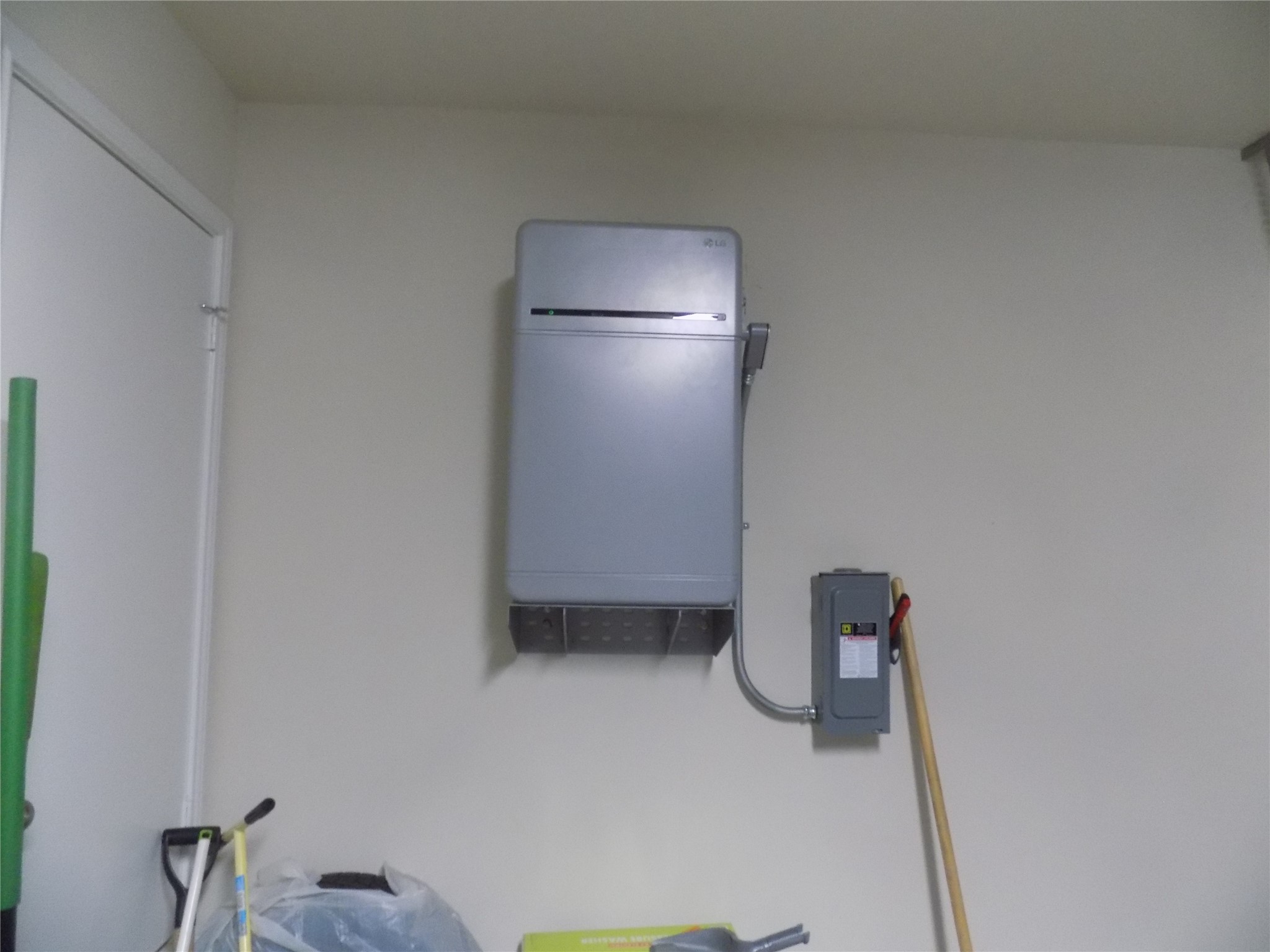 124 Rearden Boulevard Jarrell, TX 76537 - Photo 16 of 16 a water heater room with a refrigerator