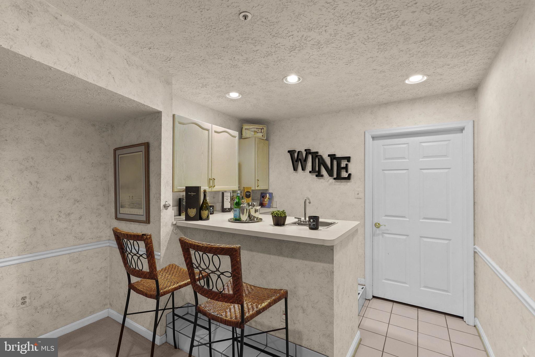 607 Lycoming Street Silver Spring, MD 20901 - Photo 39 of 70 Wet bar and storage room beyond