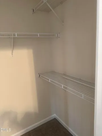 a view of a room with racks on the wall