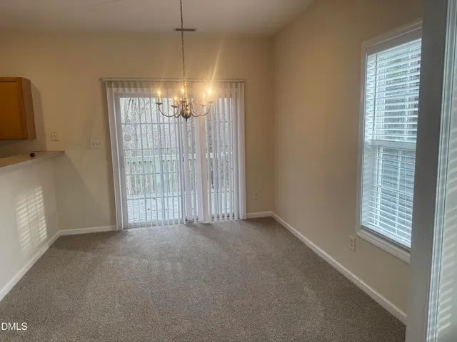 a view of empty room with windows