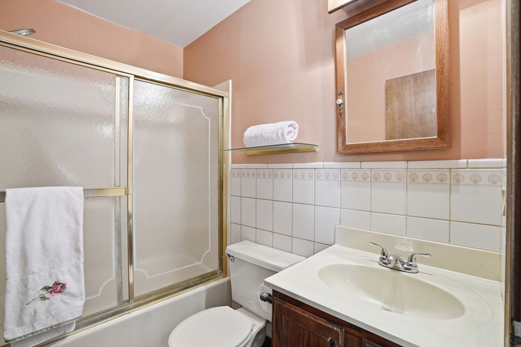 67 Wituwamat Road Weymouth, MA 02191 - Photo 14 of 42 a bathroom with a sink toilet and shower