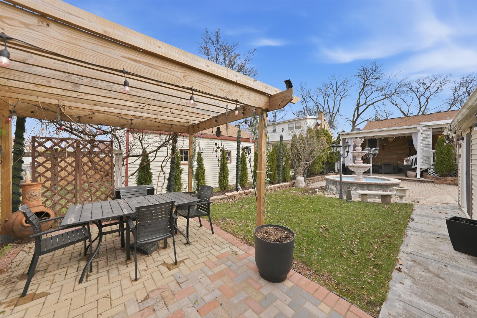 2352 2nd Avenue North Riverside, IL 60546 - Photo 26 of 37 a view of a patio with table and chairs potted plants with wooden floor and fence