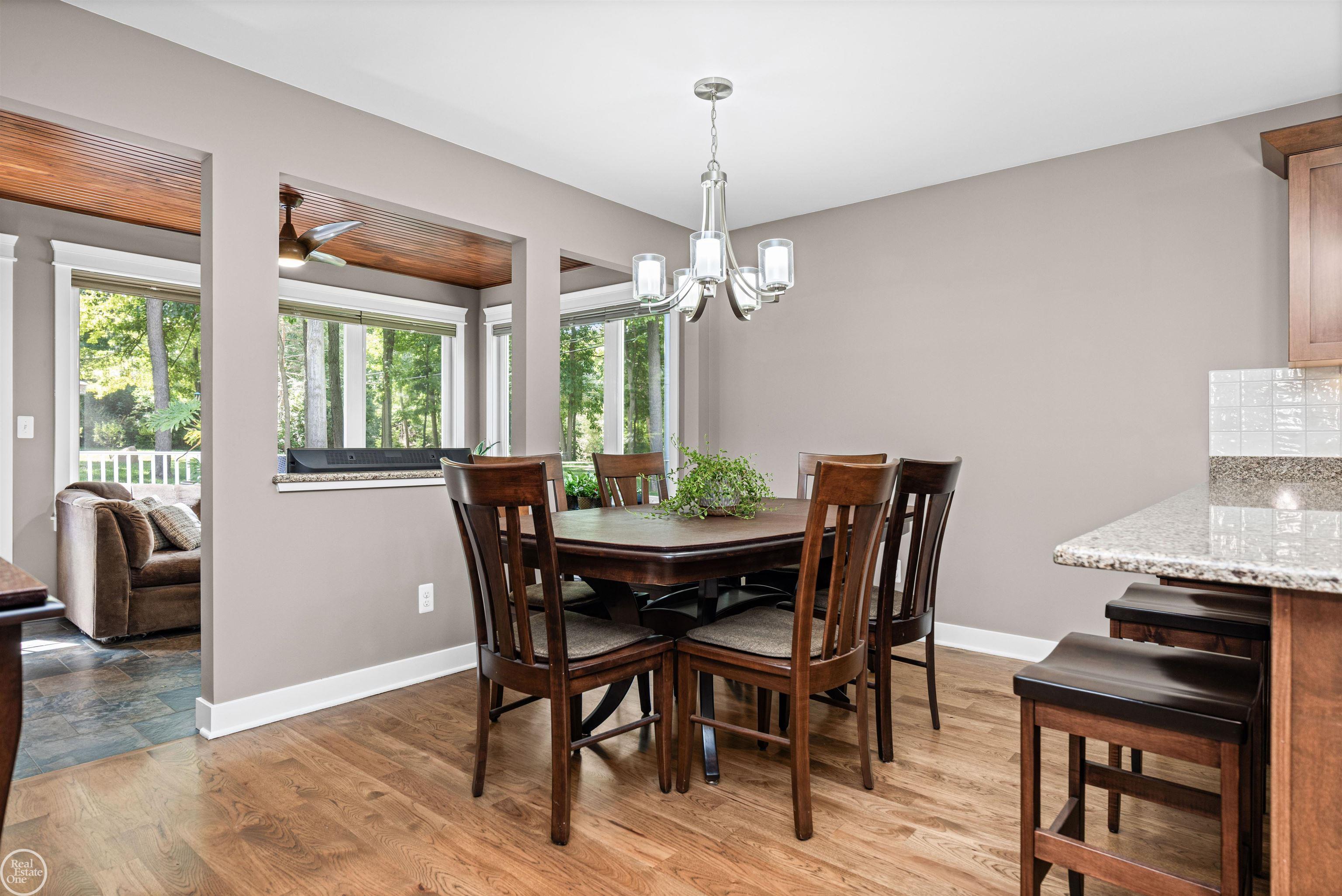64110 Campground Road Washington, MI 48095 - Photo 43 of 74 Spacious dining area with open-concept flow to four-season room