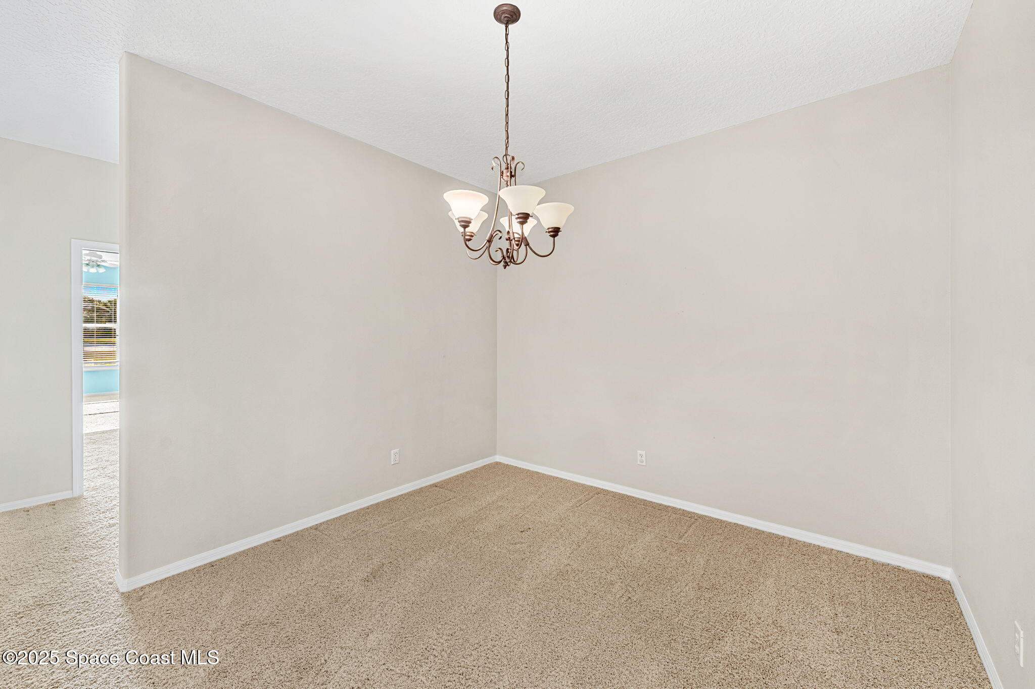 4221 Aberdeen Circle Rockledge, FL 32955 - Photo 18 of 45 a view of a chandelier in a room