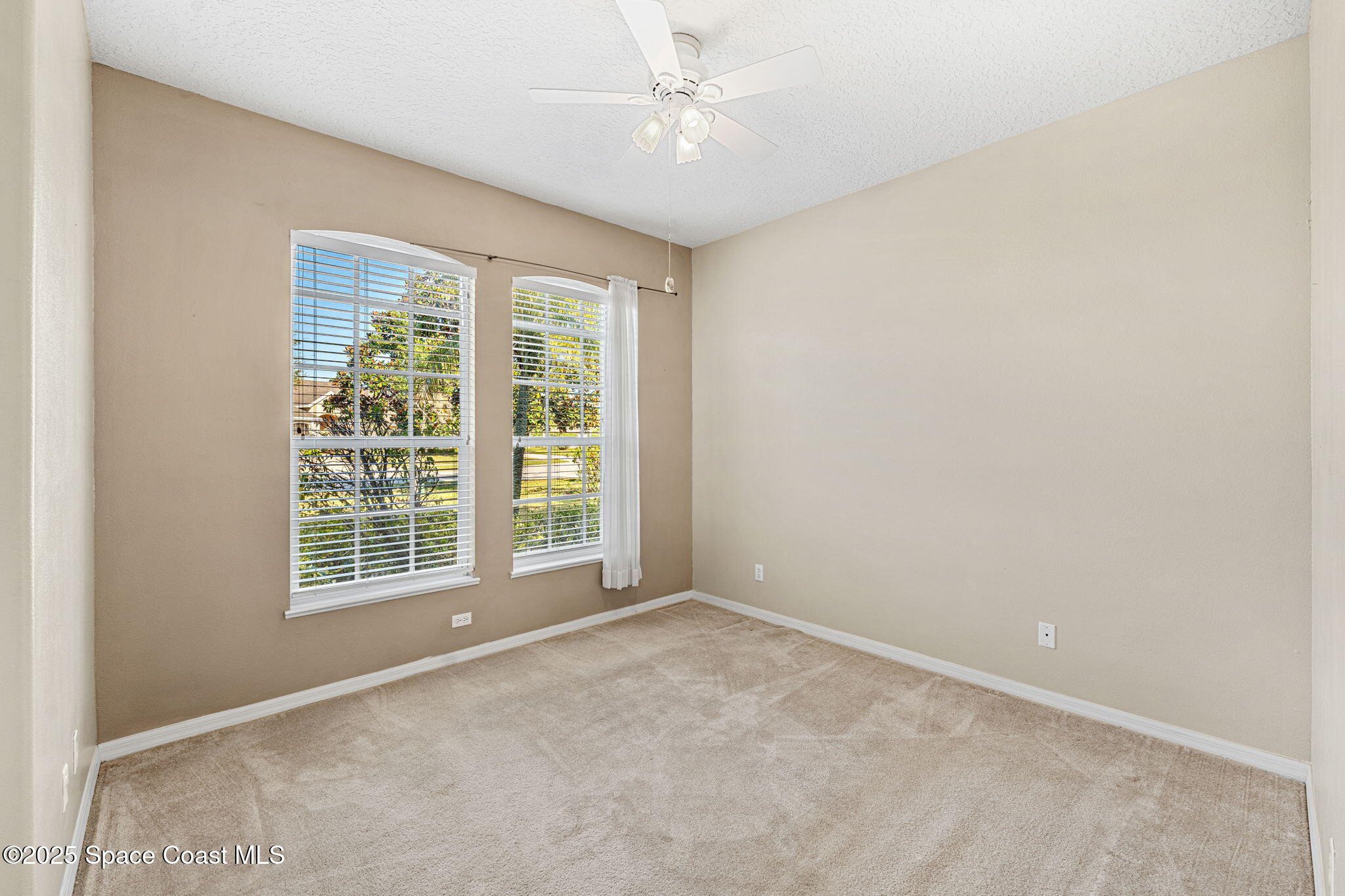4221 Aberdeen Circle Rockledge, FL 32955 - Photo 20 of 45 a view of an empty room with a window